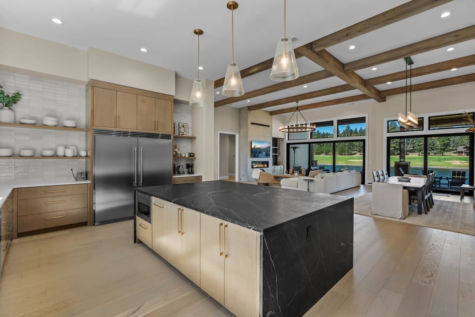 The fully equipped gourmet kitchen has everything the group needs — marble countertops, top-of-the-line stainless steel appliances, and enough prep space to make cooking for ten feel effortless.