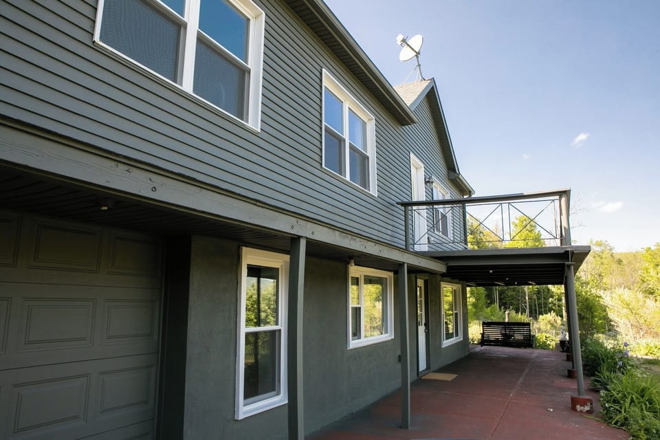Spacious mountain home with a covered patio and private upper balcony deck.