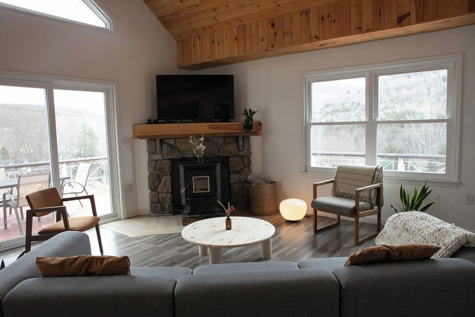 Unwind by the stone fireplace with gorgeous mountain views from every window.