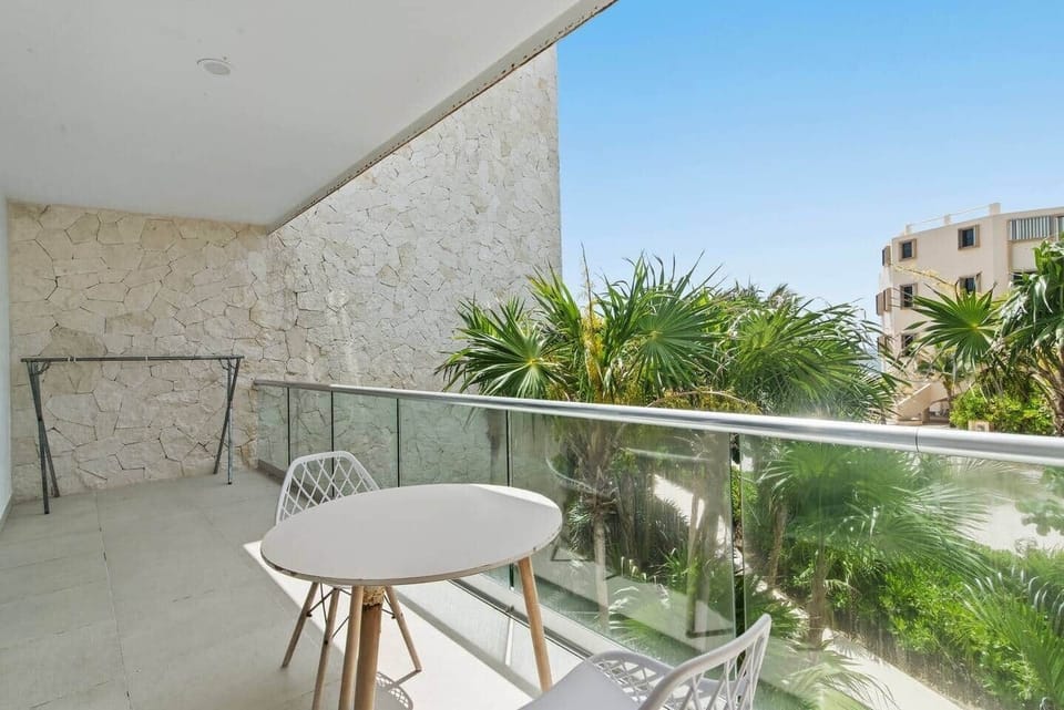 Step out to your private balcony from the bedroom or living room and enjoy greenery views, a partial ocean view, and refreshing sea breezes. Outdoor furniture and a drying rack are also available after a pool or beach day.