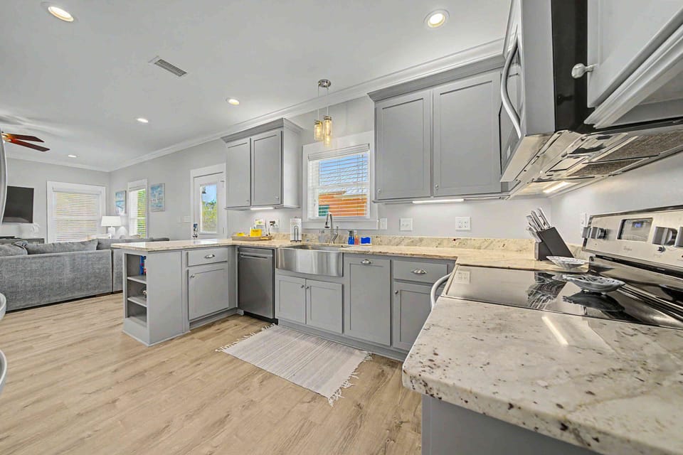 Bright modern kitchen with granite counters and open-concept layout