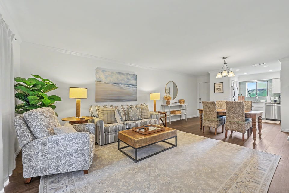 An airy, open-concept layout connects the living and dining spaces to keep everyone part of the conversation.