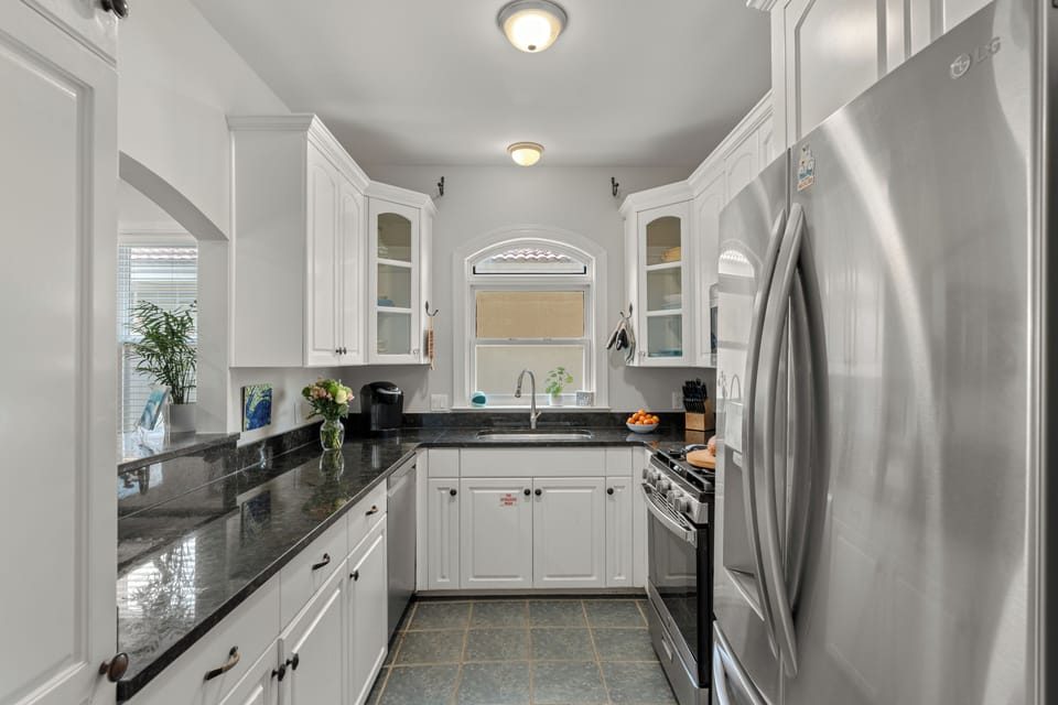Fully equipped with stainless steel appliances and generous prep areas.