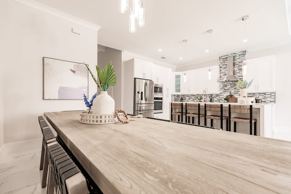 Share meals and memories around the spacious dining table just steps from the bright chef’s kitchen and oversized island.