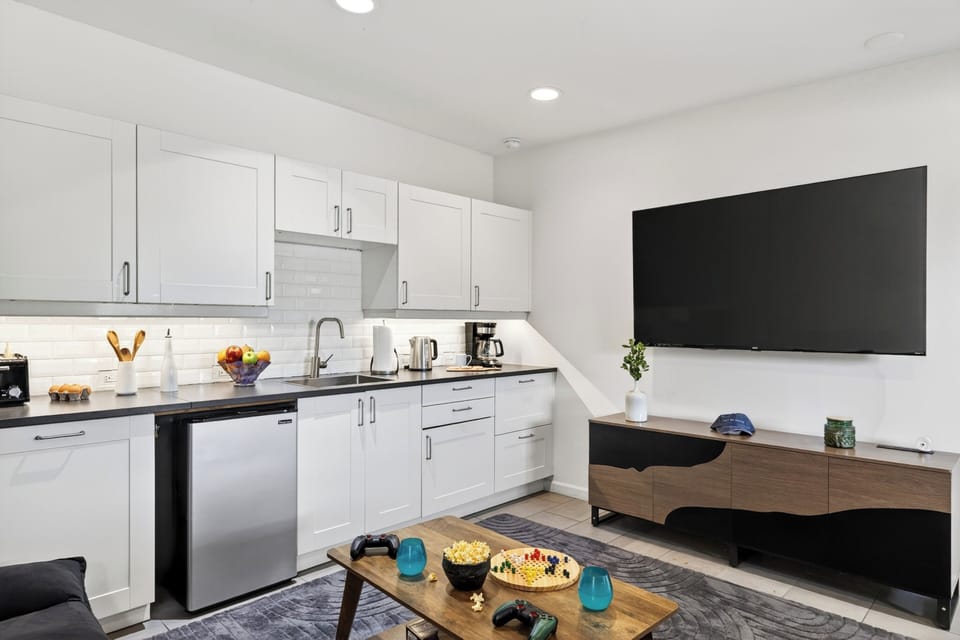 Stream your favorite shows and enjoy a comfortable stay with a full entertainment setup and sleek modern kitchenette. (Red Rock Nook)