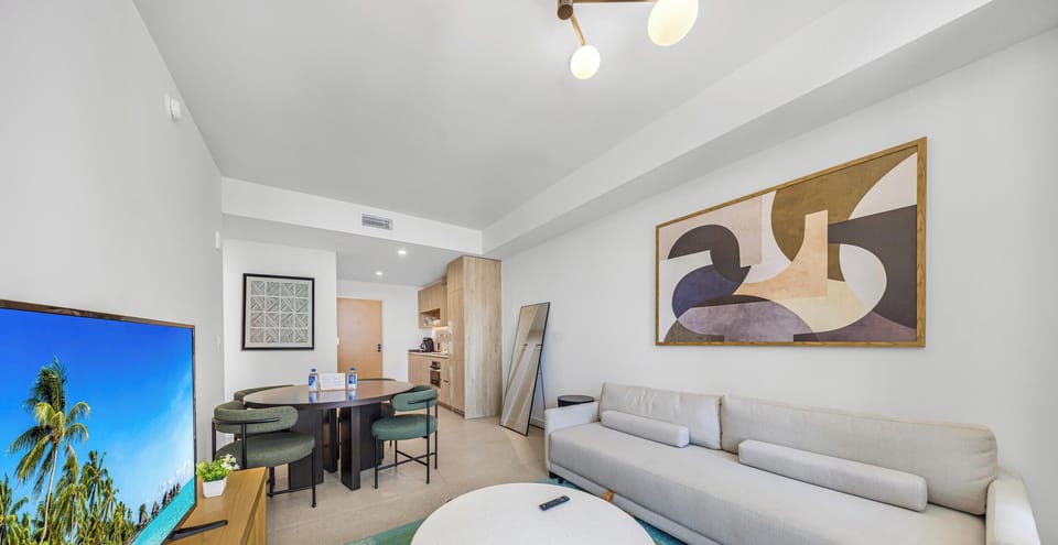 Condo, Balcony, City View | Living area | 36-inch Smart TV with cable channels