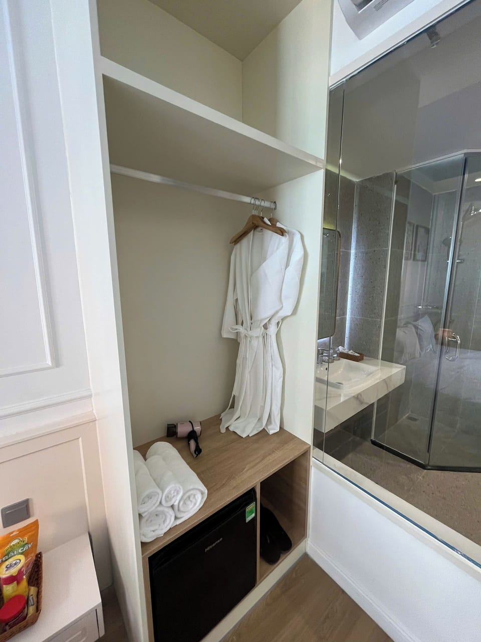 Shower, hair dryer, slippers, towels