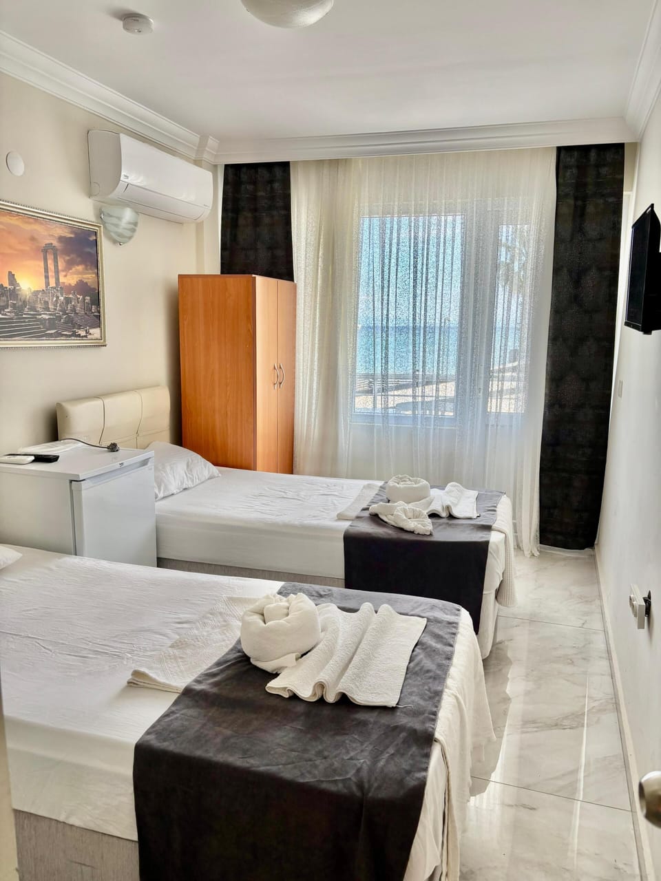 Economy Triple Room, Balcony, Beach View | Free WiFi