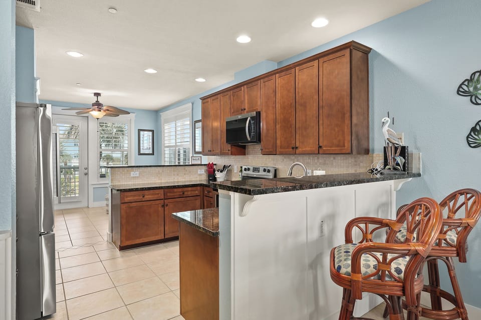 Bar seating on both sides of the kitchen