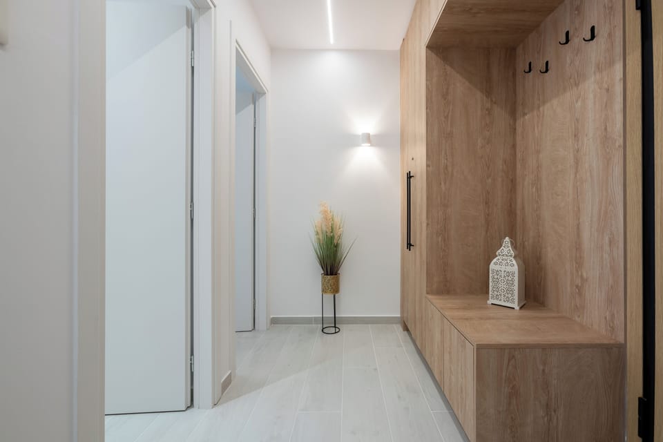 Bright hallway with stylish decor and warm ambient lighting.