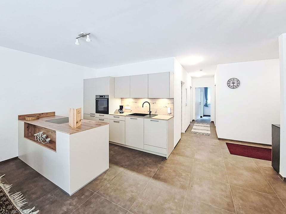 Interior Design, Flooring, Floor, Ceiling, Wood, Room, Kitchen, Countertop, Furniture, Apartment