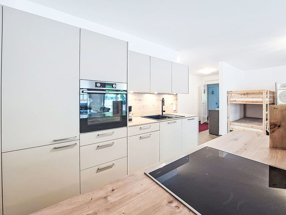 Kitchen, Flooring, Wood, Interior Design, Kitchen Appliance, Floor, Countertop, Ceiling, Cabinetry, Major Appliance