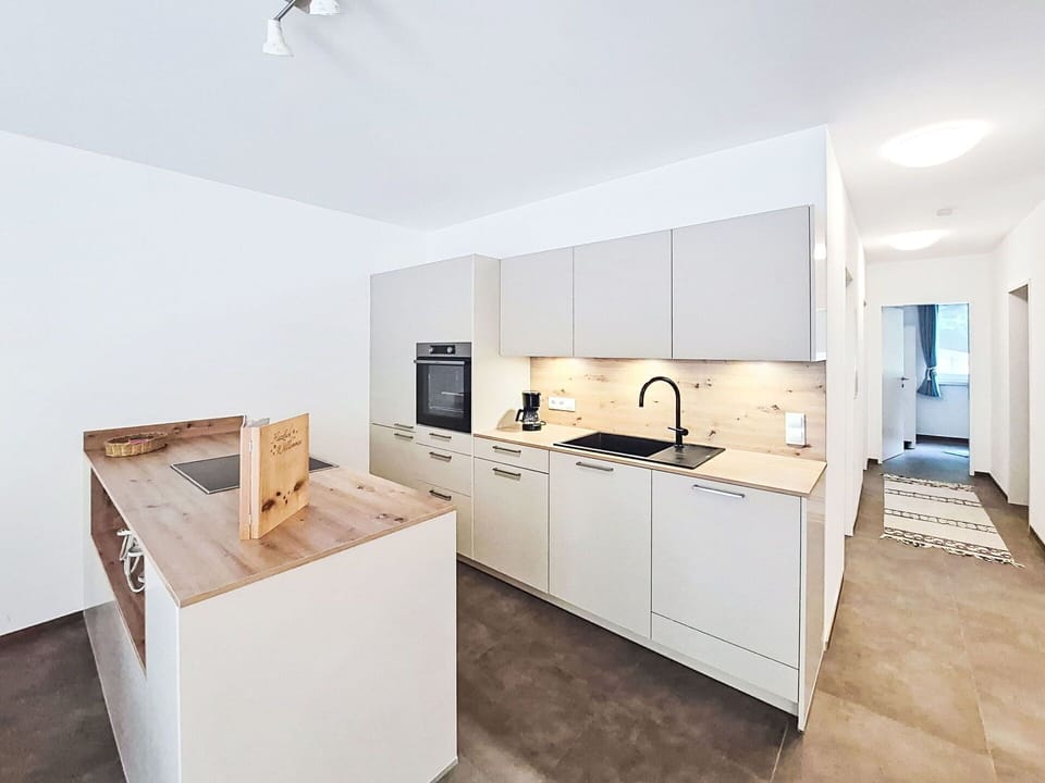 Kitchen, Countertop, Flooring, Interior Design, Floor, Kitchen Appliance, Cabinetry, Ceiling, Furniture, Room