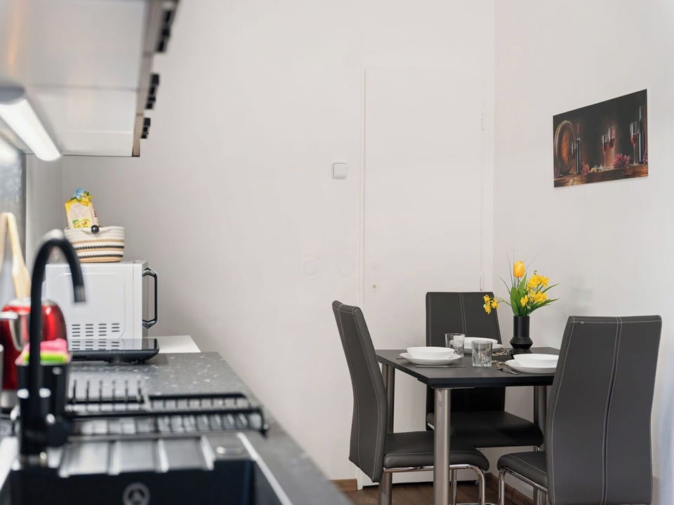 Furniture, Interior Design, Kitchen Appliance, Kitchen, Flooring, Major Appliance, Countertop, Lighting, Room, Home Appliance