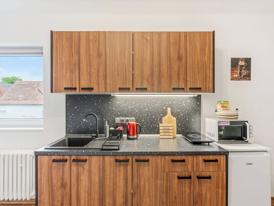 Kitchen, Wood, Countertop, Cabinetry, Interior Design, Furniture, Kitchen Appliance, Major Appliance, Brown, Kitchen Stove