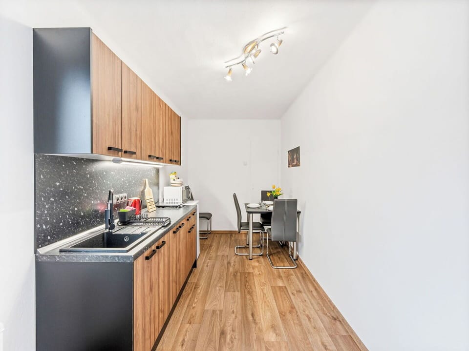 Interior Design, Flooring, Furniture, Wood, Kitchen, Countertop, Floor, Room, Cabinetry, Wood Flooring