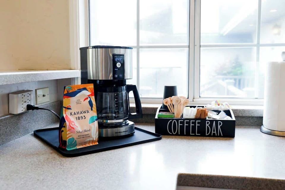 Coffee Bar with regular and decaf coffee, tea, sugars and creamers. Togo cups for those morning strolls to the beach.
