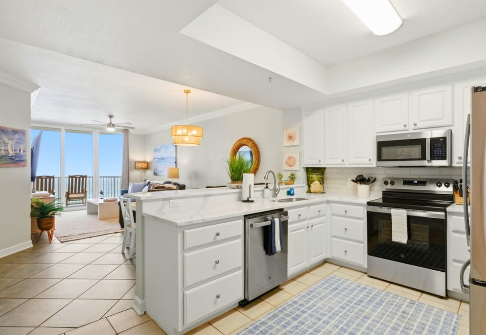 Crisp white cabinetry and a functional layout make this kitchen both stylish and practical for your stay.
