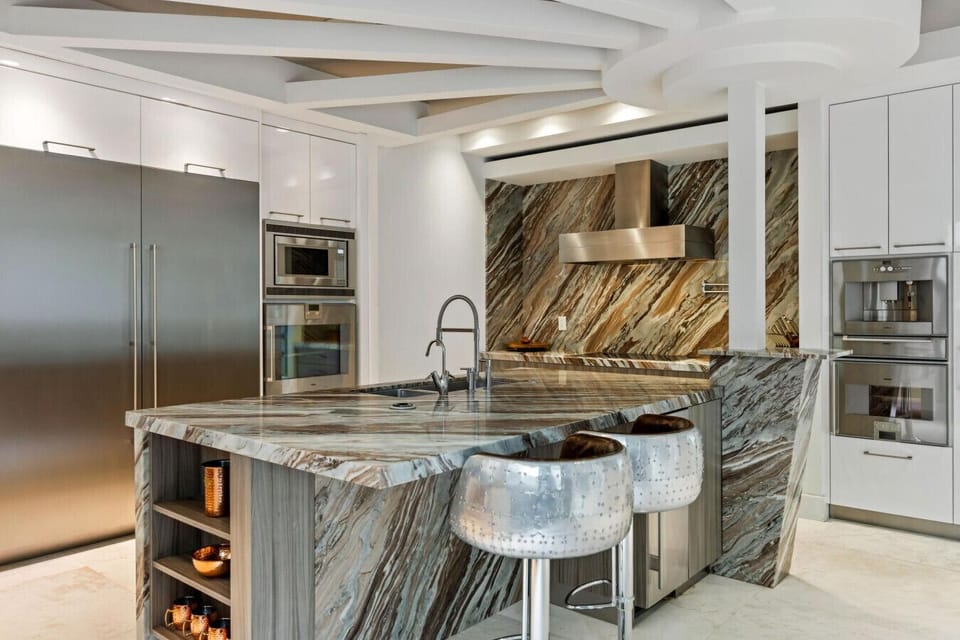 Stunning marble kitchen island with integrated sink and premium stainless steel finishes