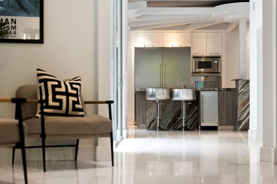 Stylish seating nook with designer armchair and black & white accent cushion
