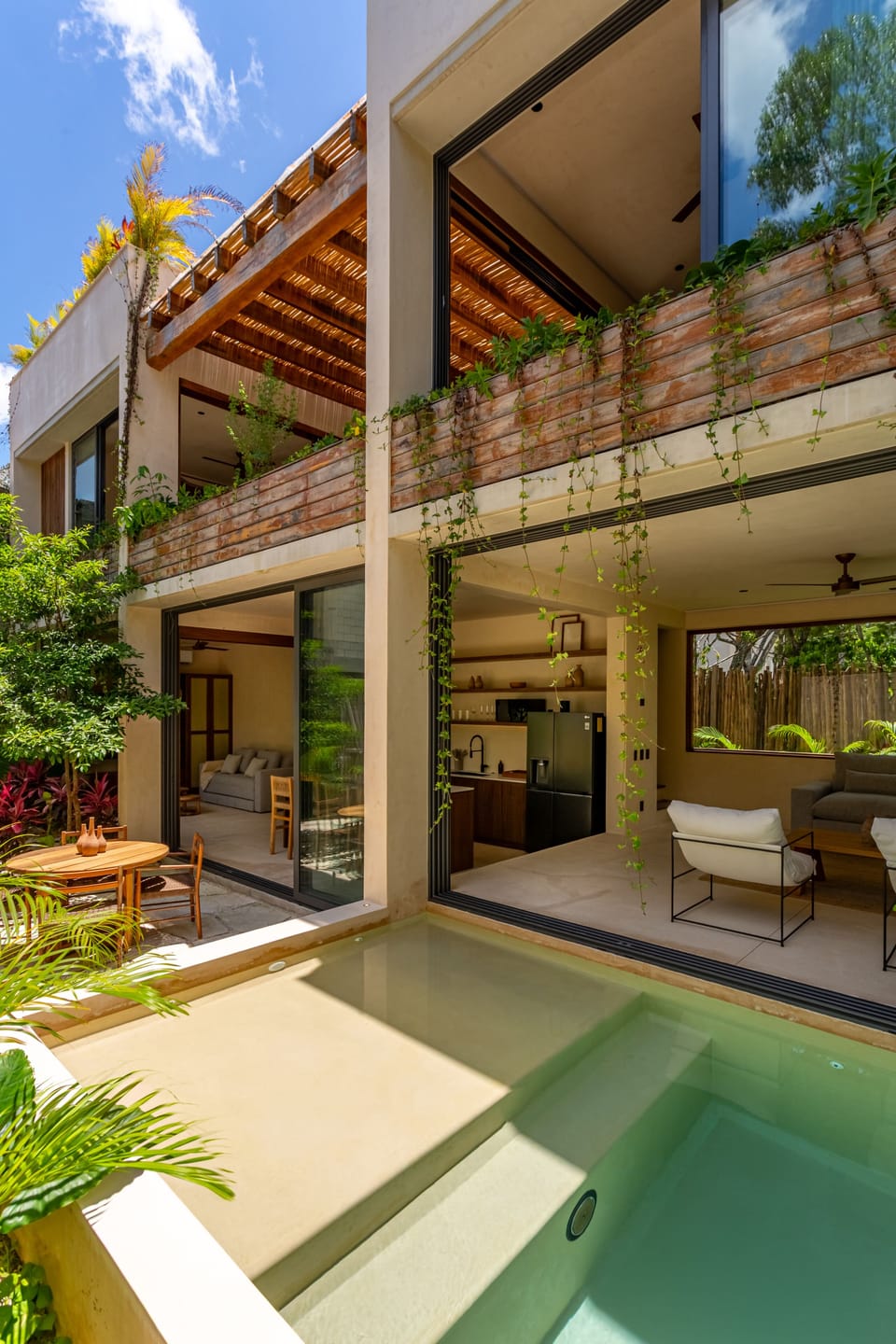 The villa features a fenced garden for privacy and its own private pool.