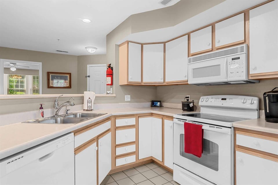 The open kitchen offers ample space & all the comforts of home​