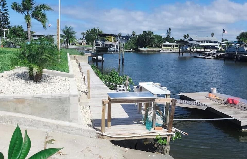 Private floating dock for boating, kayaking, swimming, and canal access.