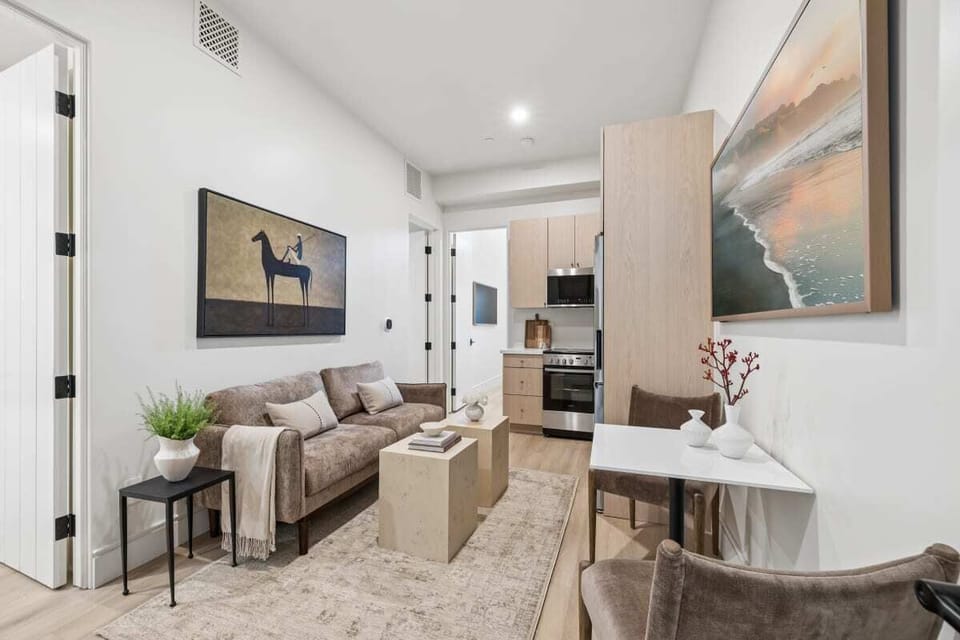 Seating area with sofa , Lounge chairs and 65" Hisense TV