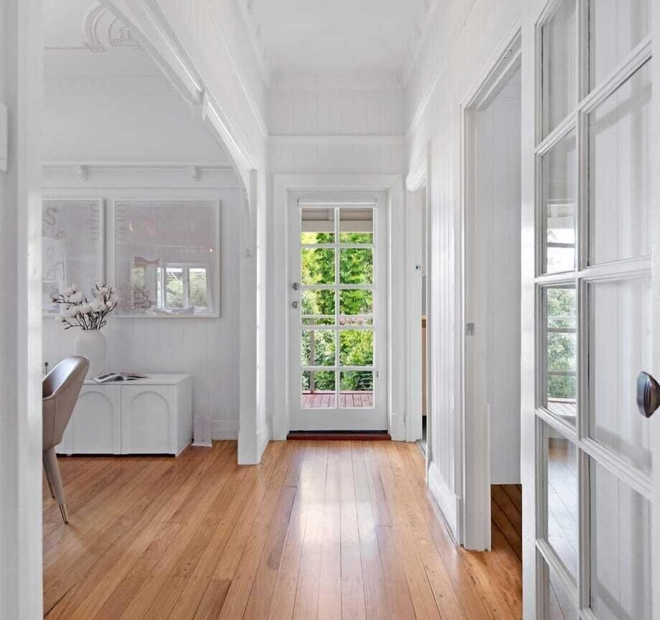 Charming hallway with natural light and polished timber floors