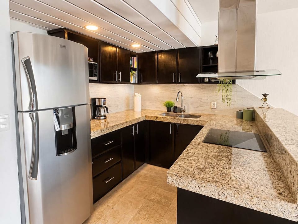Fully equipped kitchen with modern appliances for easy meals at home