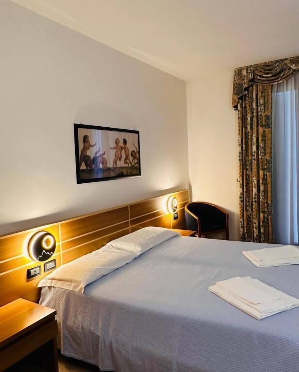 Family Twin Room, Private Bathroom | Minibar, in-room safe, desk, laptop workspace