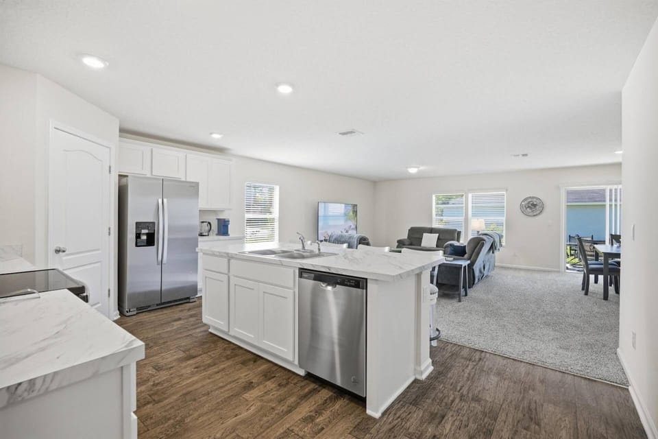 Fully equipped kitchen featuring generous counter space and bar seating for easy dining, conversation, and entertaining.