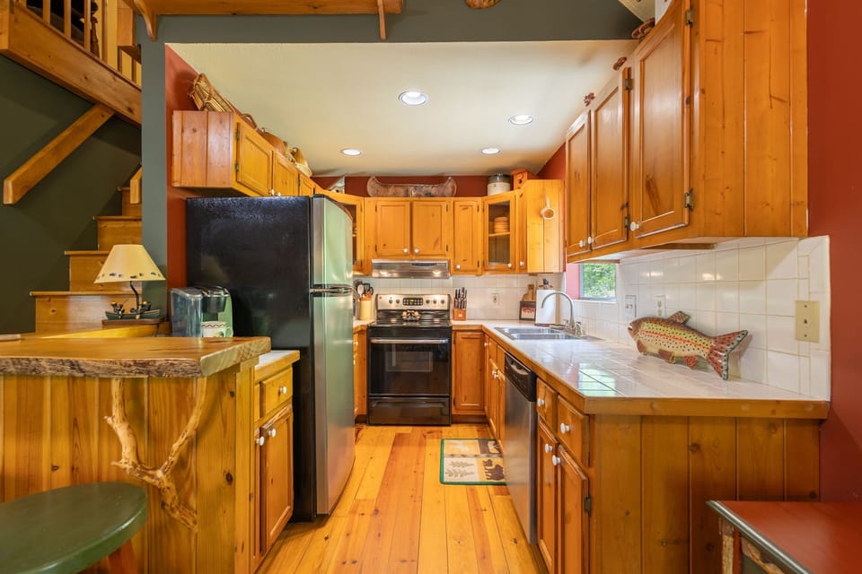 The kitchen offers a warm and functional layout with everything needed for cooking, gathering, and everyday convenience.