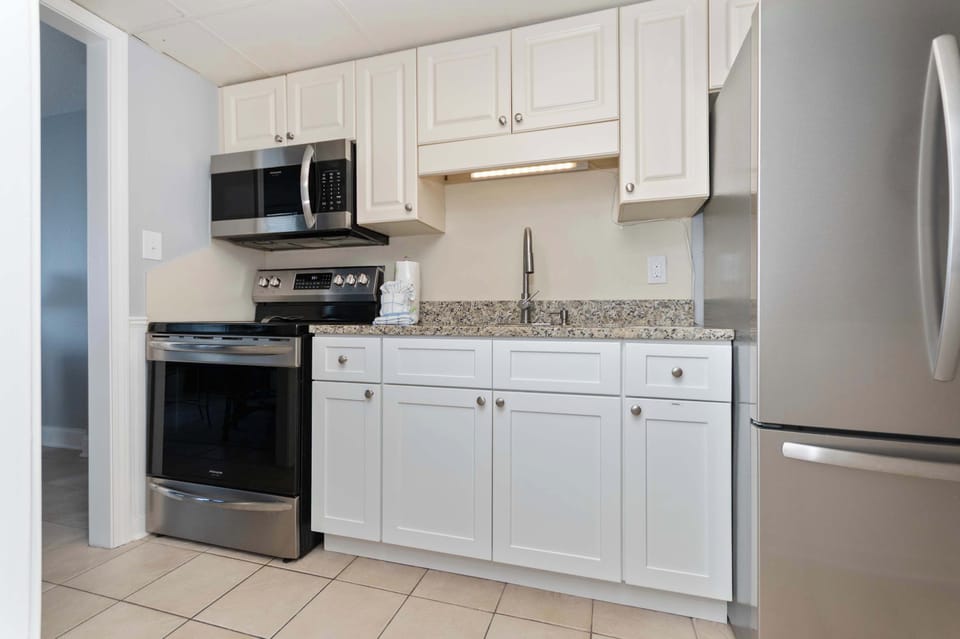 Cook your favorite meals with ease in this bright and fully equipped vacation kitchen.