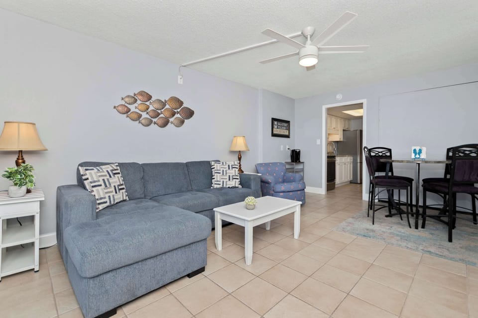Gather together after beach adventures in this cozy and inviting coastal retreat.