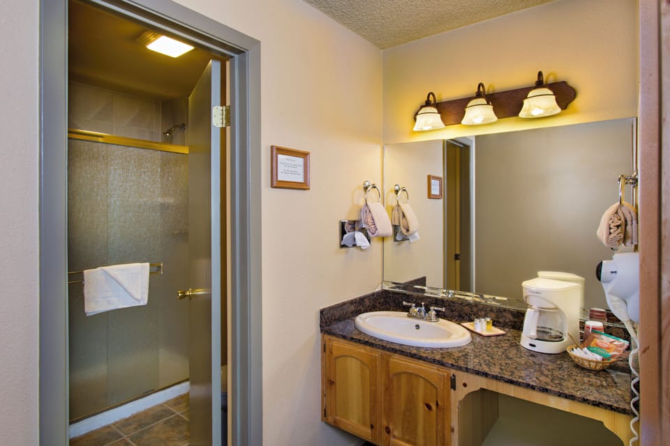 Refresh easily with bright vanity lighting and a clean shower.