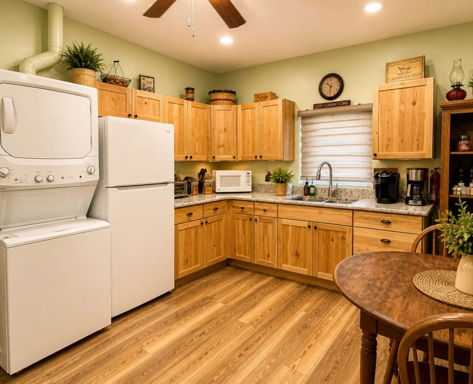 Fully equipped kitchen with modern appliances, coffee bar, and in-unit laundry—designed for a convenient and comfortable cabin stay.
