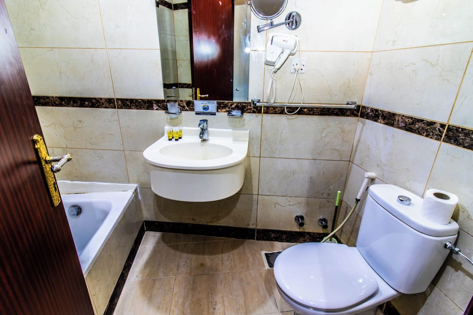 Luxury Triple Room | Bathroom | Shower, hair dryer, towels, soap