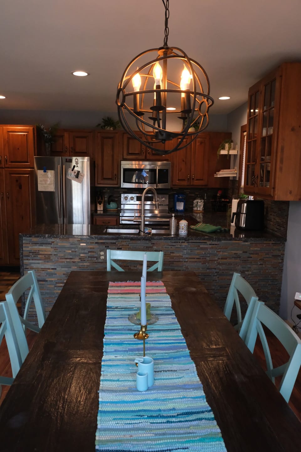 Open kitchen features a breakfast bar and spacious dining area.