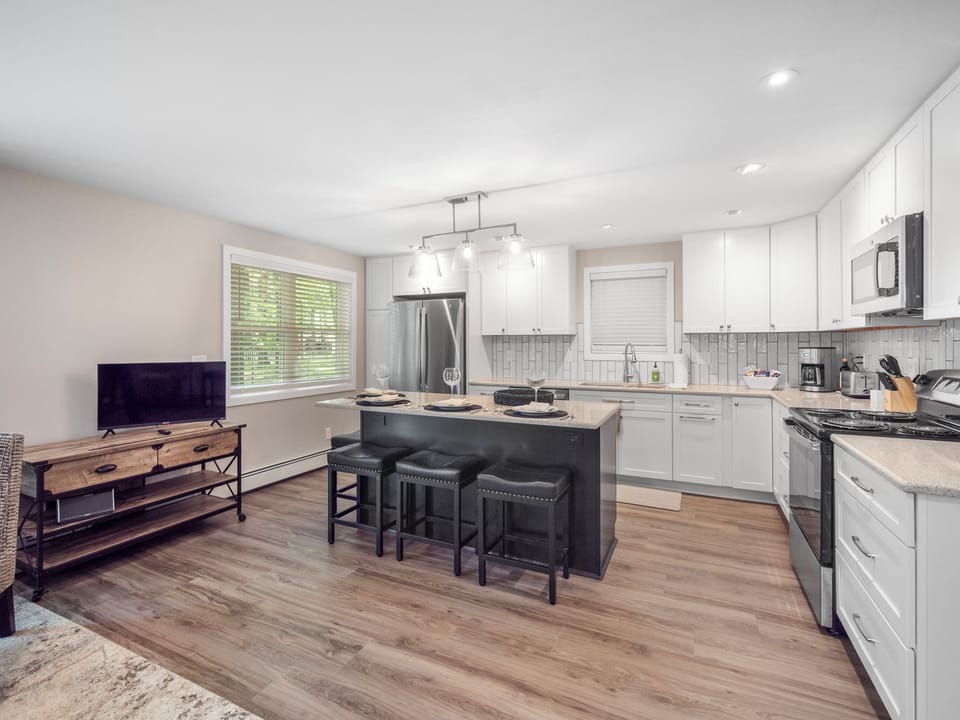 Spacious bright kitchen with wooded views.  Well equipped for in home dining.