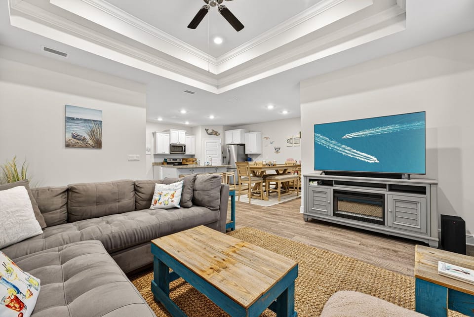 Sink into this plush sectional after a day at the beach. Your group can gather here to share stories, stream favorite shows on the big screen, or simply unwind with the coastal-inspired décor around you.