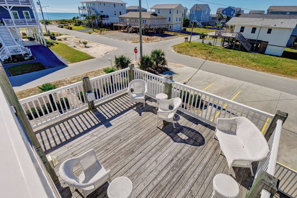 Relax in the shared outdoor seating area: perfect for morning coffee, afternoon breezes, or unwinding after a day at the beach