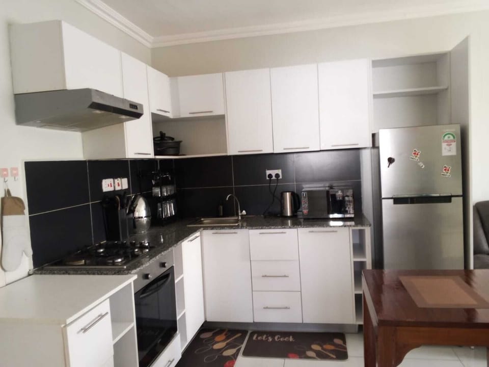 microwave,coffee maker, kitchen, oven, refrigerator, stovetop, kitchen visible