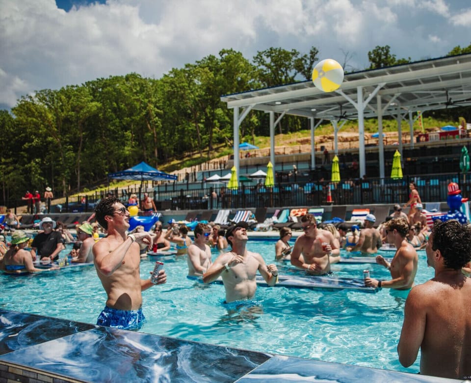 Energetic resort pool experience with swim-up fun, live entertainment, and nonstop summer vibes at Lake of the Ozarks.
