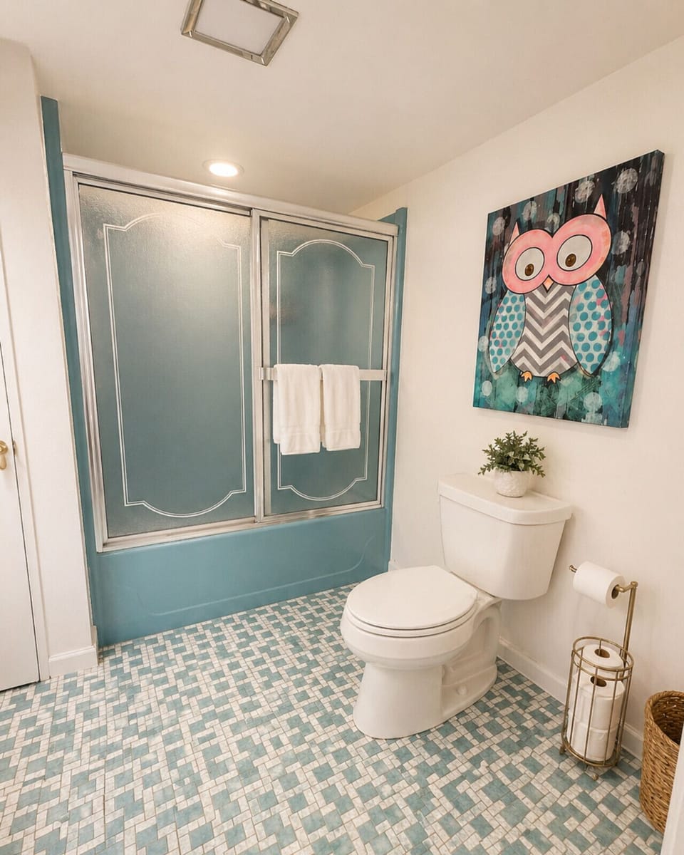 Bright and spacious bathroom with tub/shower combo, modern finishes, and ample space—perfect for family stays, comfort, and everyday convenience.