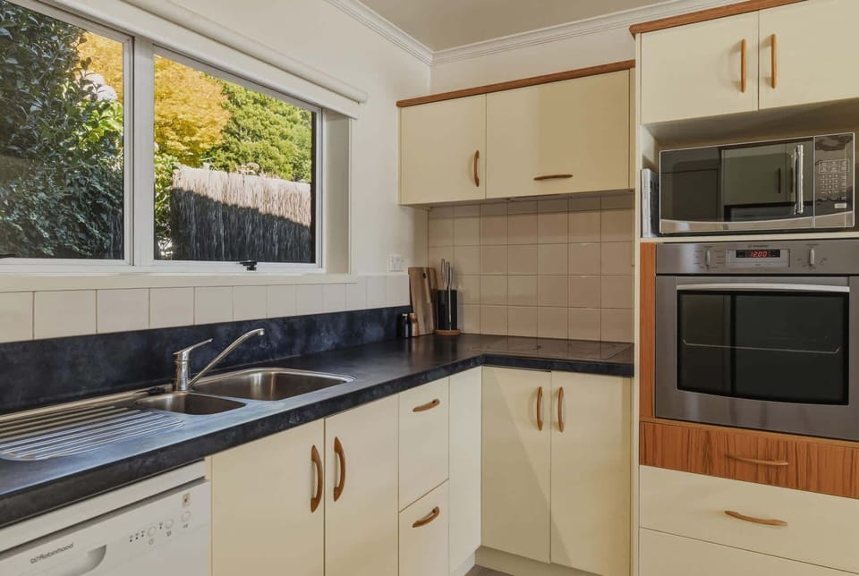 Galley kitchen with wall oven