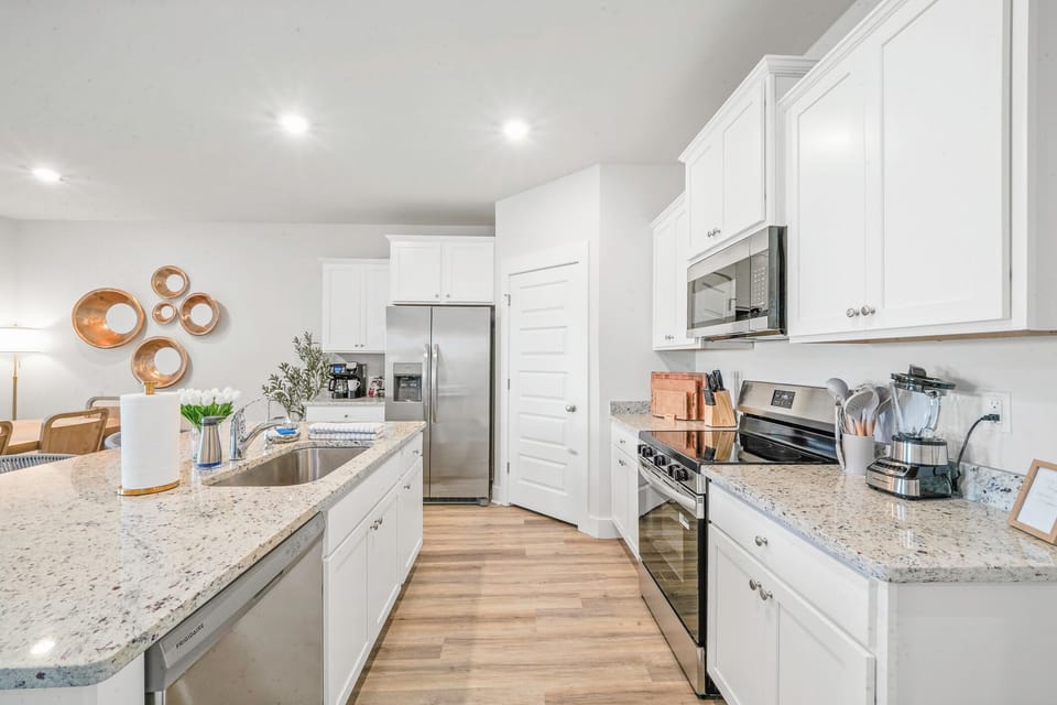 Fully stocked kitchen with modern appliances and plenty of space to cook. Perfect for family meals, gatherings, and morning coffee
