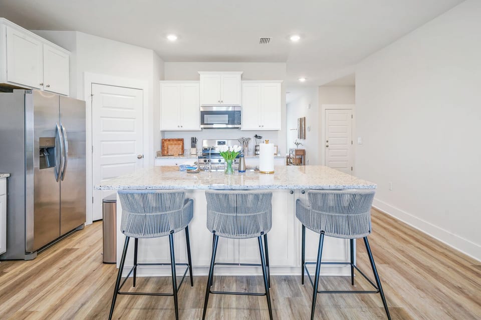 Gather around for meals and memories in this fully stocked kitchen space