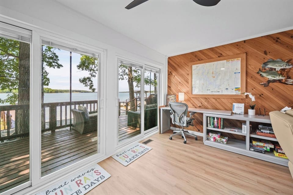 The sitting room/office has expansive views of the lake and offers a place to set up a workspace.  You'll also find a variety of books and board games for a rainy day.
