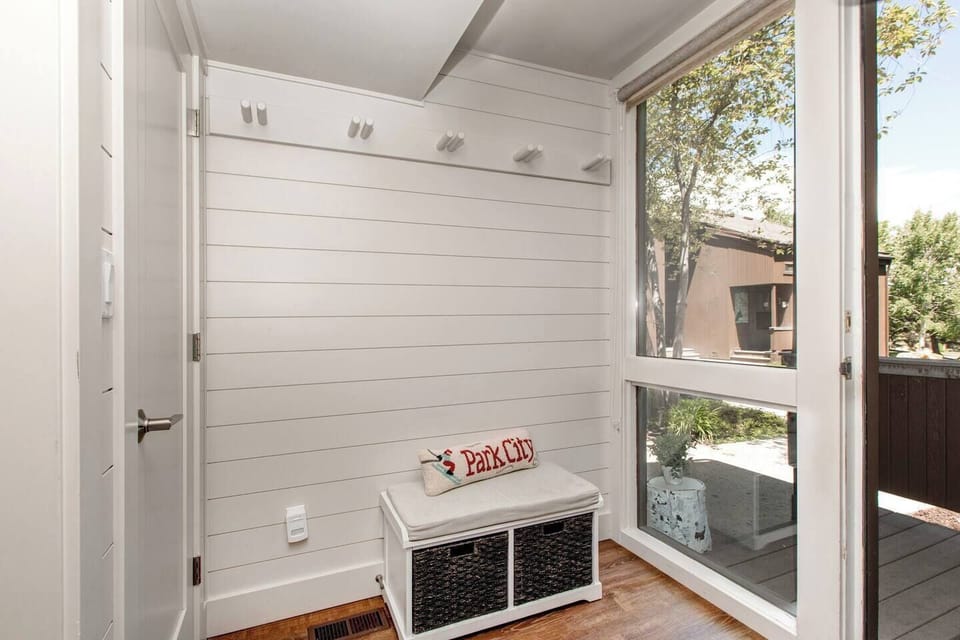 Condo entry area for shoe storage and ski storage